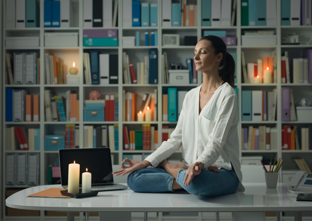 Woman practicing meditation at home